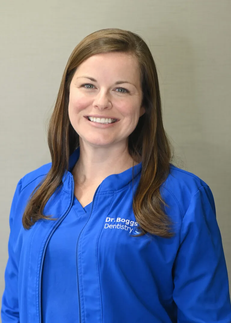 Headshot of Amanda Gilliland, RDH wearing a blue scrubs against a plain white background.