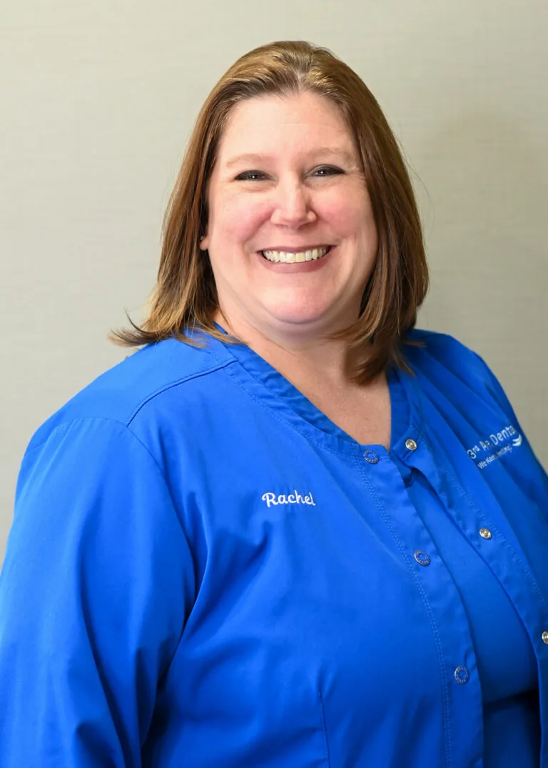 Headshot of Rachel McManus wearing a blue scrubs against a plain white background.