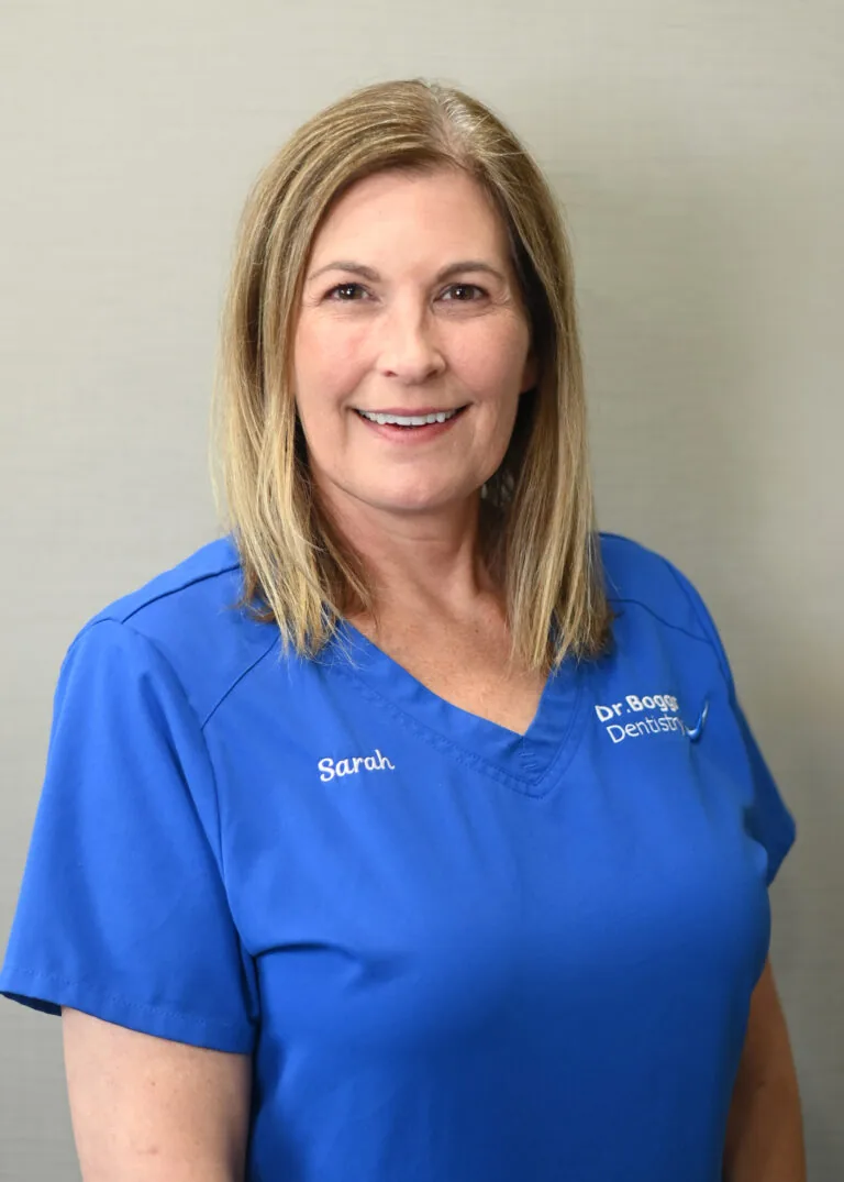 Headshot of Sarah Welborn wearing a blue scrubs against a plain white background.