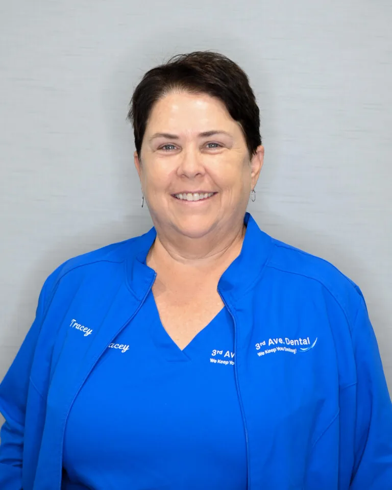 Headshot of Tracey Horton wearing a blue scrubs against a plain white background.